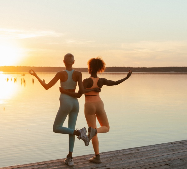 fitness friends connecting at the beach